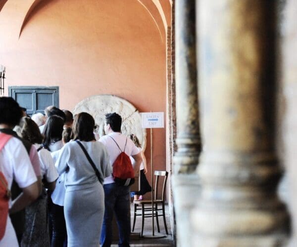 Rome, Italy – October 10, 2018: Visitors waiting to see the mouth of truth (Bocca della Verità). It attracts visitors who audaciously stick their hand in the mouth. Church of Santa Maria in Cosmedin in Rome, Italy